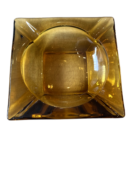 Top view of Vintage Amber glass ashtray on white background.