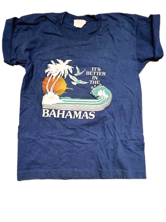 Front of blue t-shirt with 'its better in the Bahamas' graphic on white background.