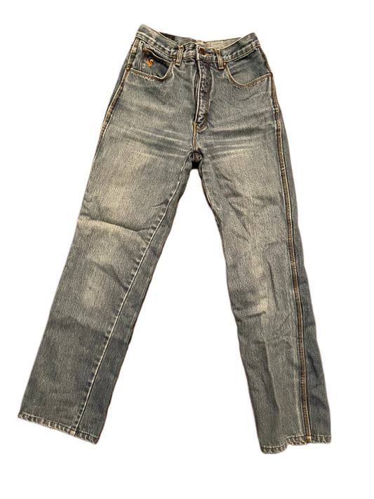 Lay down shot of vintage 1980s Gloria Vanderbilt jeans on white background.