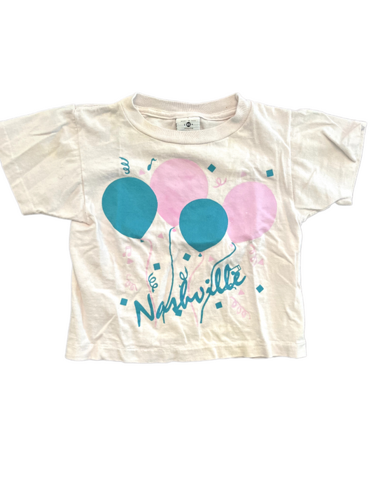 Image of a size youth XS Nashville graphic tee with white and pink balloons on a white background.