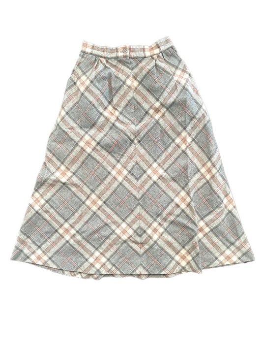 Vintage ladies 7/8ths plaid skirt in pink, grey and white with front zipper and button on white background.